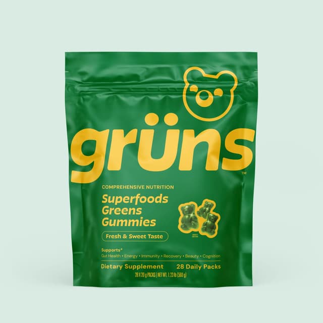 The Grüns greens gummies pouch in bright green and yellow packaging